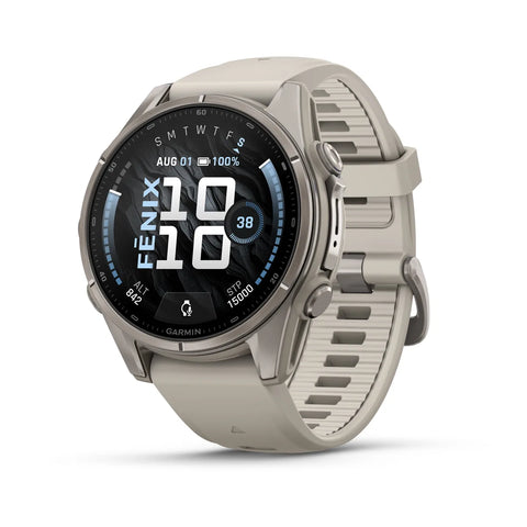 A Garmin smartwatch with a round silver-tone case and a light beige textured silicone strap, shown at a three-quarter angle on a white background.