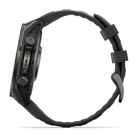 A dark gray rugged smartwatch shown from the side profile, featuring a textured black strap and a dark metallic case with physical side buttons, set against a plain white background.