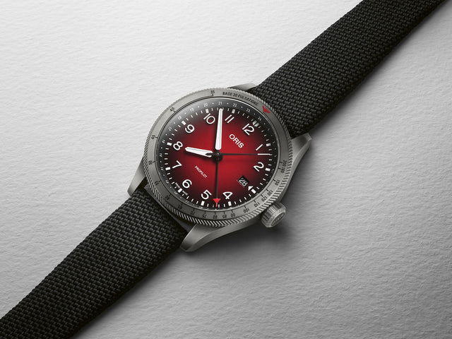 Oris ProPilot GMT Watch with red dial, textile strap, grey pvd case