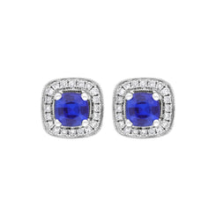 18ct white gold earrings featuring cushion-cut sapphires weighing 0.95 carats, complemented by diamonds totaling 0.19 carats in a claw and pave setting. The earrings exhibit a refined design that highlights the vibrant sapphires and sparkling diamonds.