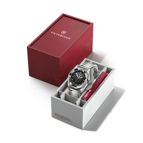 Silver watch in a white box with a red interior, featuring the Victorinox logo.
