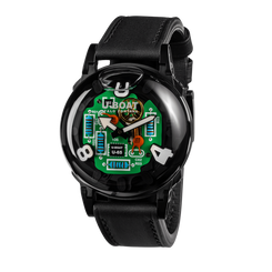 A wrist watch with a black leather strap and a glossy black round case. The dial features a bright green circuit-board design with blue, orange, and white details, and large white Arabic numerals for the hours.