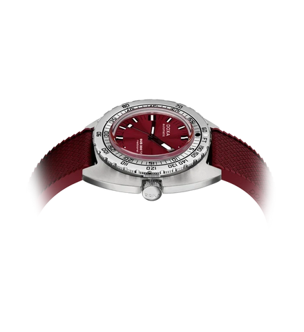 A wristwatch with a silver-toned case, a deep red dial, and a matching red textured strap, shown on a plain white background.
