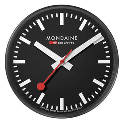 A round black wall clock with a minimalist design, featuring white hour markers and hands, a red second hand, and the brand name 'MONDAINE' printed on the dial.