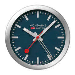 Mondaine wall clock with blue face and silver frame on a white background