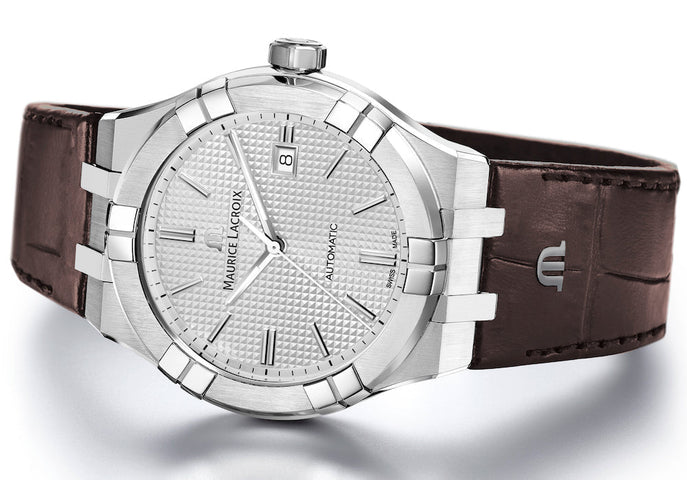 Maurice Lacroix watch with brown leather strap on a white background