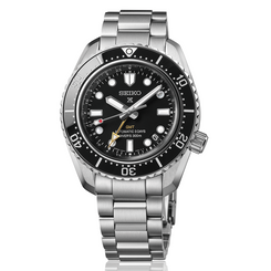 Seiko watch with black dial and silver metal strap on a white background