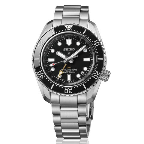 Seiko watch with black dial and silver metal strap on a white background
