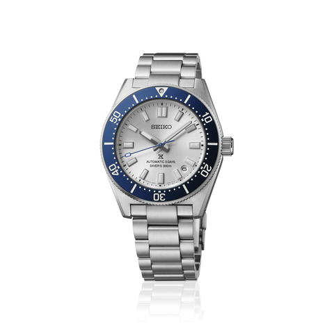 Seiko watch with silver bracelet and blue bezel on a white background