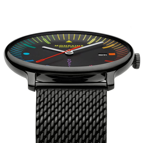 Mondaine watch with colorful face and black mesh band on white background