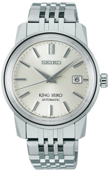 Silver Seiko watch with a white face on a white background