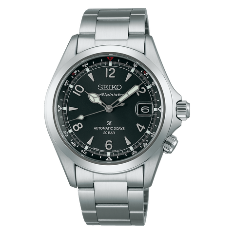 Seiko watch with black dial and silver metal strap on a white background