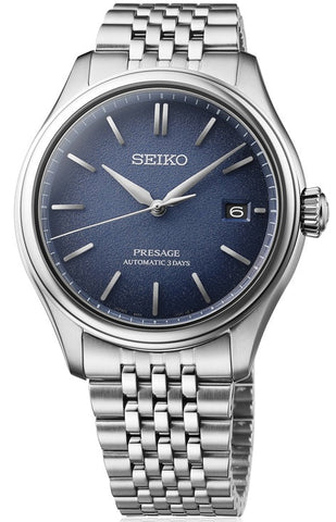 Seiko watch with blue dial and silver metal bracelet on a white background
