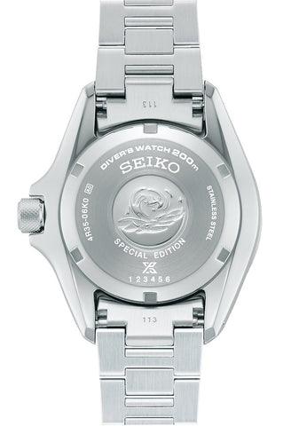 Silver Seiko watch with detailed caseback on a white background