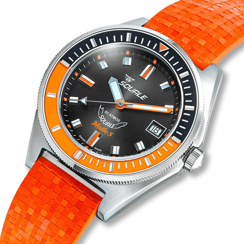 Watch with orange strap and black dial on a white background