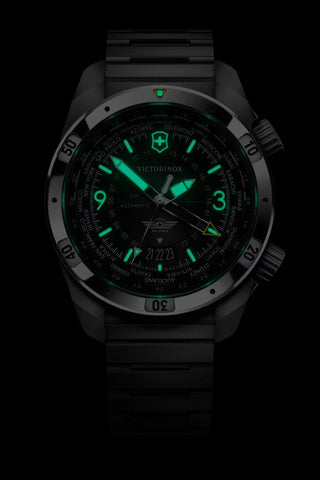 Black watch with green glowing face on a black background