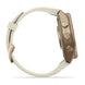 A smartwatch shown from the side profile on a clean white background. The watch features a light beige leather strap and a metallic bronze-toned case with three prominent side buttons.