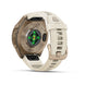 A Fénix 9 GTS smartwatch shown from the back, featuring a metallic bronze case, a light beige silicone strap, and a central green LED light indicator, set against a clean white background.