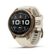 A Fenix smartwatch by Garmin with a round bronze-toned case and a light beige silicone strap, shown on a clean white background.