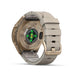 Fenix 9 Pro smartwatch shown from the back, featuring a metallic bronze case, a light beige quick-dry strap, and a central green LED heart rate sensor.