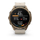 A Garmin smartwatch with a round bronze-toned case and a light beige strap, shown on a clean white background. The watch face is active with various fitness and heart rate metrics displayed.