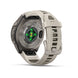A smartwatch shown from the back with a light beige silicone strap and a dark gray metallic case. The back of the watch features a circular sensor area with green and orange illuminated LED lights, and the brand name 'FENIX 9' is visible on the casing.