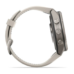 A smartwatch shown from the side profile, featuring a dark gray metallic case with three silver side buttons and a light gray silicone strap with white stitching, set against a plain white background.