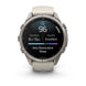 A Garmin smartwatch with a round silver titanium case and a light beige silicone strap, shown on a clean white background. The watch face is active, displaying sleep and fitness metrics.