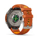 Fenix 9 Pro smartwatch with an orange silicone strap and a metallic silver back casing, shown on a clean white background.
