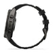A black rugged smartwatch shown from the side profile against a clean white background, featuring a textured black strap and a dark metallic case with visible button controls and the brand name 'FENIX'.
