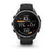 A Garmin smartwatch with a black strap and dark gray metallic case, displaying a fitness watch face with Polish text on a clean white background.