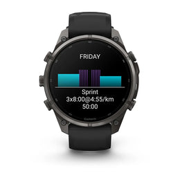 A Garmin smartwatch with a black strap and dark metallic case, shown from the front on a white background. The watch screen displays a fitness summary for 'FRIDAY' with a sprint workout record.