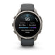 A Garmin smartwatch with a dark gray silicone strap and a silver-toned metal case, shown on a clean white background. The watch face is active with a sleep tracking display.