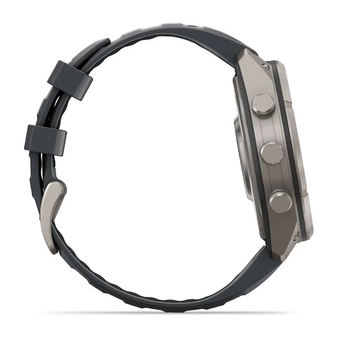 A side profile view of a rugged smartwatch with a dark gray textured silicone strap and a metallic gray case, featuring three side buttons, set against a plain white background.