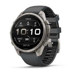 A Garmin Fenix smartwatch with a dark gray silicone strap and a silver-toned titanium case, shown at a three-quarter angle on a clean white background.