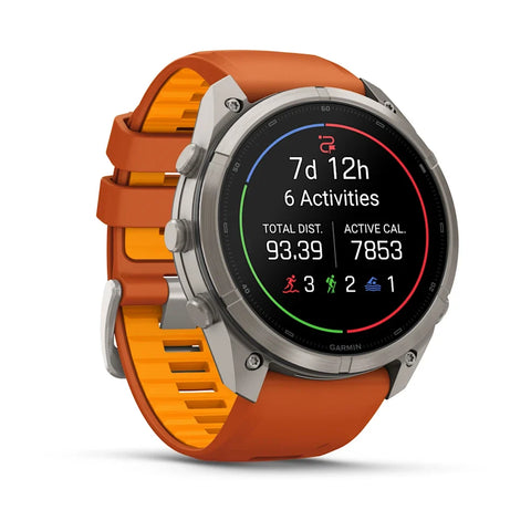 A Garmin smartwatch with a silver-toned metal case and a vibrant orange and yellow gradient silicone strap, shown on a clean white background with a soft shadow.