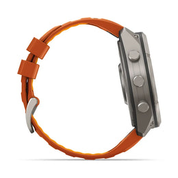 A side profile view of a rugged smartwatch with a metallic gray case and a vibrant orange silicone strap, shown on a clean white background.