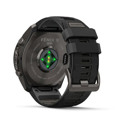 Rear view of a black Nuvito Fenix 9 Pro smartwatch with a titanium case and black strap, featuring a green and red LED light indicator on the back.