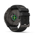 A black Garmin Fenix 9 Pro smartwatch shown from the back, featuring a rugged black strap, titanium case, and a green-lit heart sensor on a clean white background.