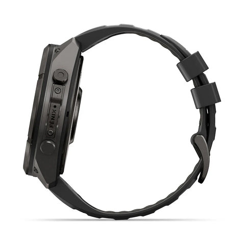A black rugged smartwatch shown from the side profile against a clean white background, featuring a textured black strap and a dark metallic case with visible buttons and the FENIX brand name.