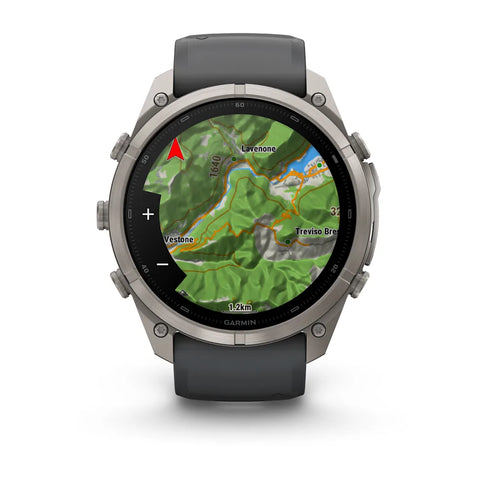 A rugged smartwatch with a round silver-tone metal case, dark gray strap, and a map display on the screen, shown on a clean white background.