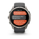 A Garmin smartwatch with a dark gray strap and a silver-toned metallic case, displaying a messaging screen on a clean white background.