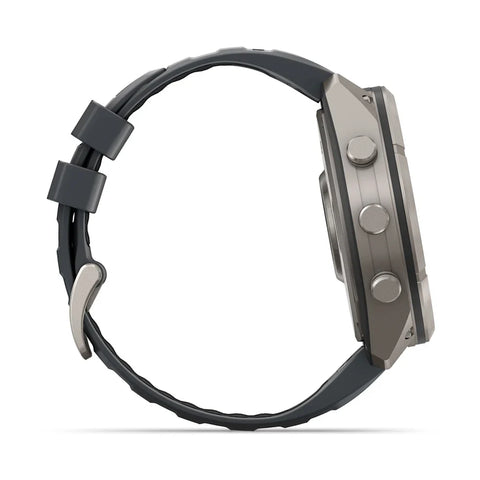 A side profile view of a rugged smartwatch with a dark gray textured strap and a metallic gray case, set against a plain white background.