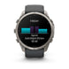A Garmin smartwatch with a dark gray strap and a silver-toned metallic case, shown against a plain white background. The watch face displays a fitness screen with a black background, a cyan and purple bar, and white text reading 'FRIDAY', 'Sprint', '3x8:0