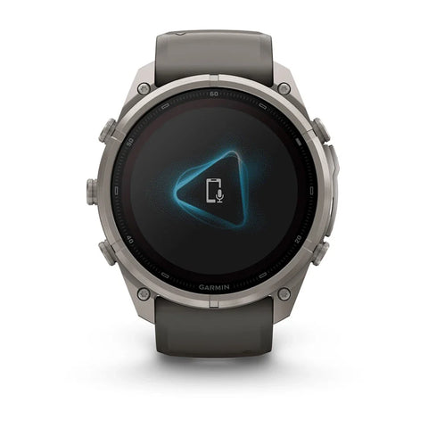 A Garmin smartwatch with a dark gray strap and a metallic silver-toned case, shown from the front on a clean white background.