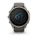A Garmin smartwatch with a dark gray strap and a metallic silver-toned case, shown from the front on a clean white background.