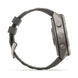 A side profile view of a rugged smartwatch with a dark gray textured strap and a metallic gray case, set against a plain white background.