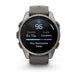 A Garmin smartwatch with a dark gray silicone strap and a metallic gunmetal gray case, shown on a clean white background. The watch face is active, displaying sleep and heart rate metrics.