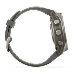 A side profile view of a rugged smartwatch with a dark gray silicone strap and a metallic gray case, featuring three side buttons, set against a plain white background.
