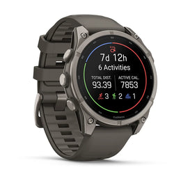 A Garmin smartwatch with a dark gray silicone strap and a metallic gray bezel, displaying fitness metrics on a black screen against a white background.